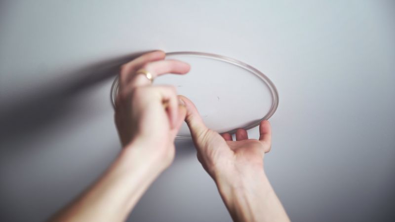 Handyman Installing a Light Fixture